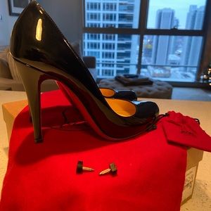 Christian Louboutin Decollete patent black leather shoes.